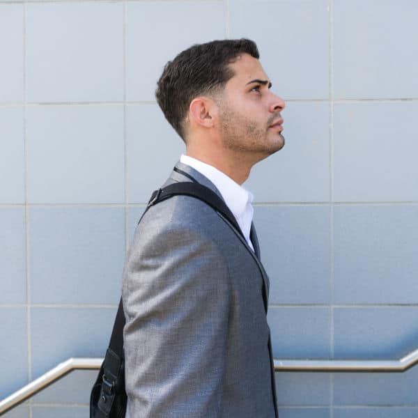 photo of professional walking up stairs