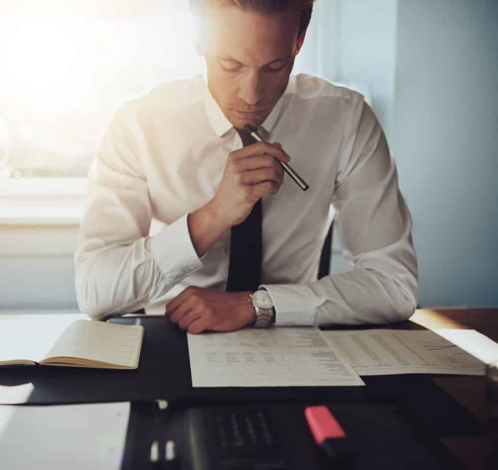 Serious business man working on documents