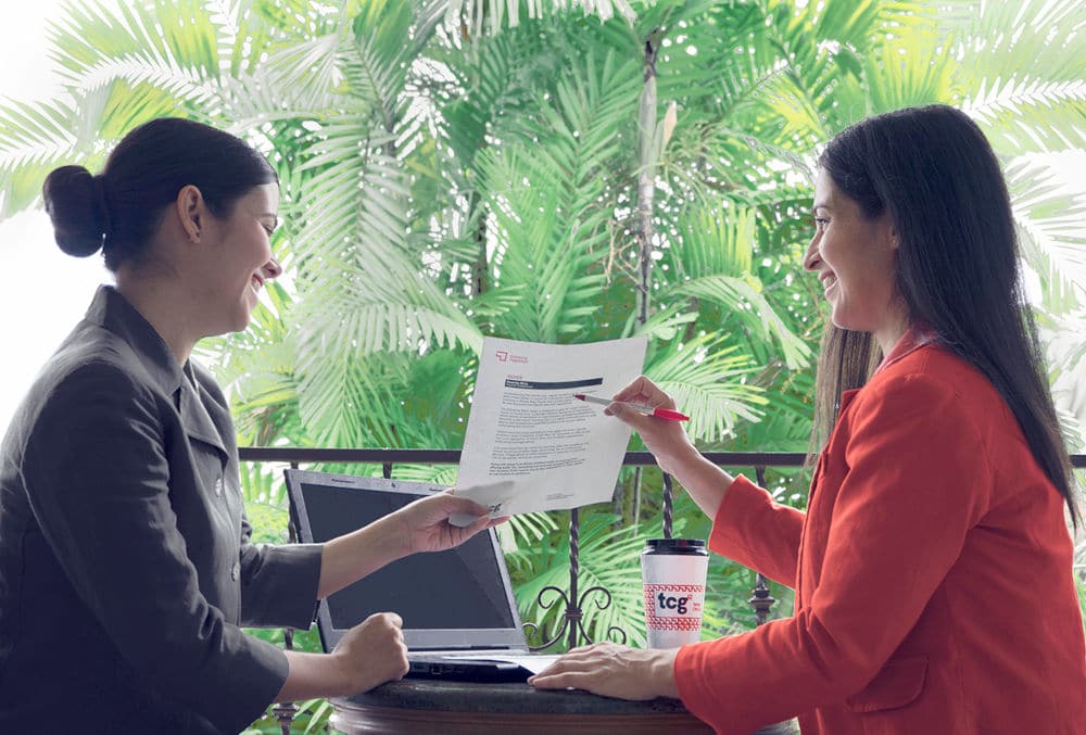 torres cpa employee pointing out important terms on paper